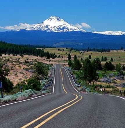 Road and mountains on Bend Breakaway tour