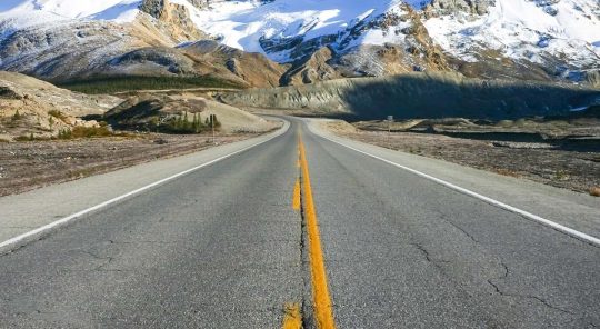 Road and mountains on the Glacier-Banff-Jasper Bike Tour