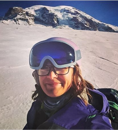 woman at snowy mountain base