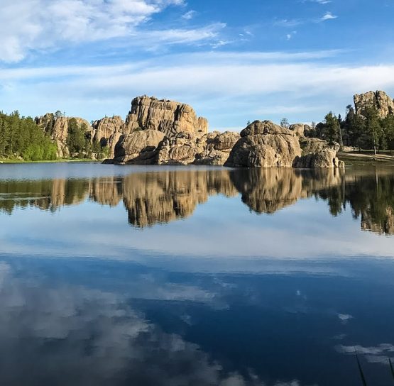Reflection on lake on Mt. Rushmore Family Tour