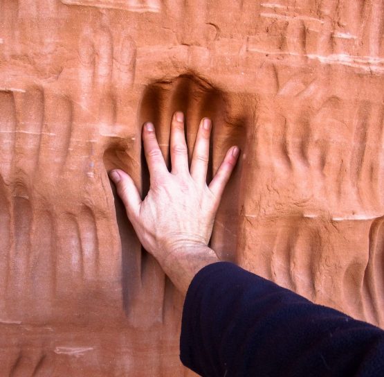 Handprint in cave in the Southern Utah National Parks tour